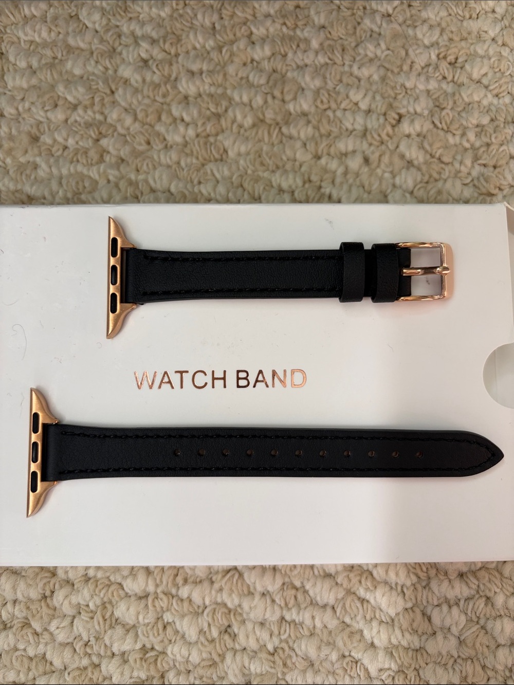 Black leather and rose gold Apple Watch band